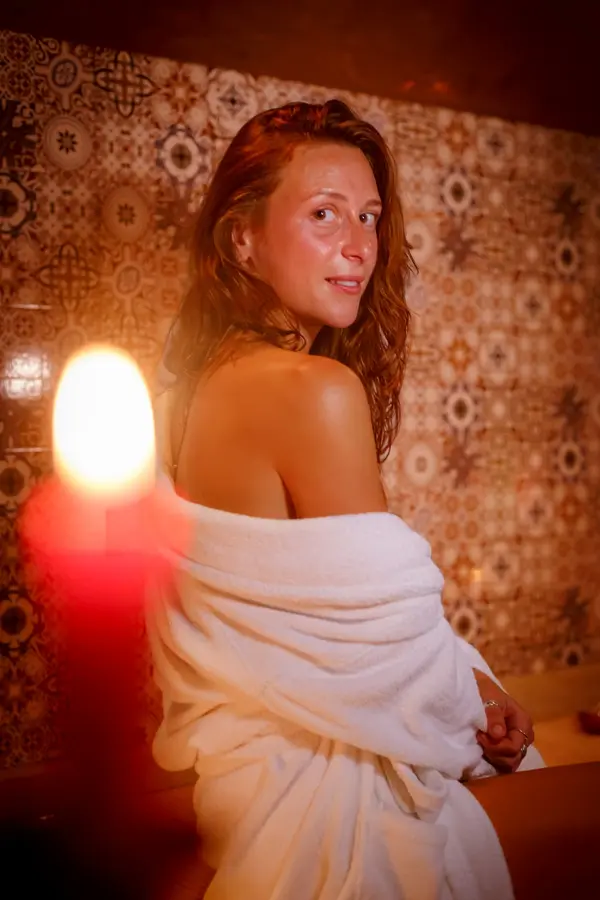 Woman in a white bathrobe by candlelight - Dragonzay Photography