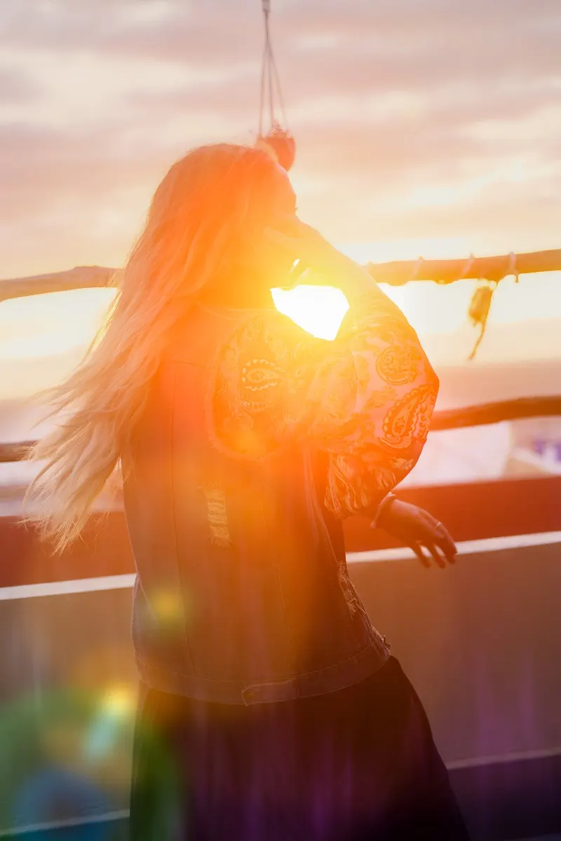 Bride dancing at sunset on a seaside terrace - Dragonzay Photography