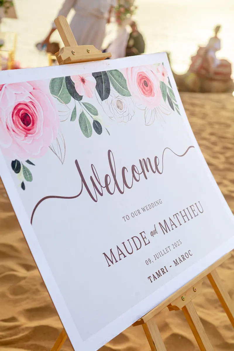 Floral welcome sign for Maude and Mathieu s wedding in Tamri - Dragonzay Photography
