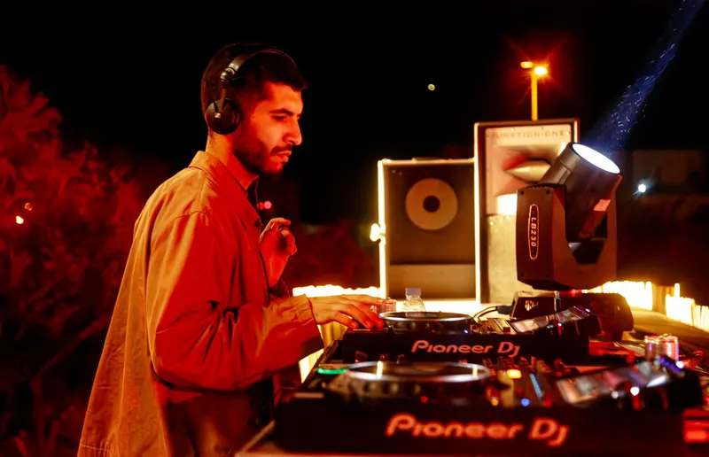 DJ on Pioneer decks at an open-air party - Dragonzay Photography