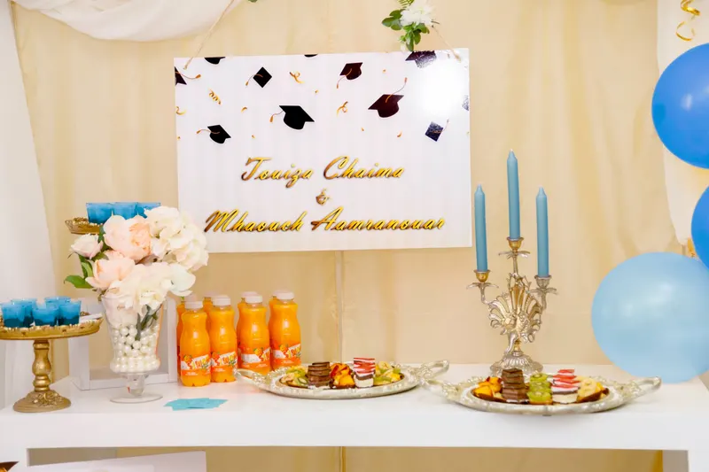 Decorated party table for a graduation celebration - Dragonzay Photography