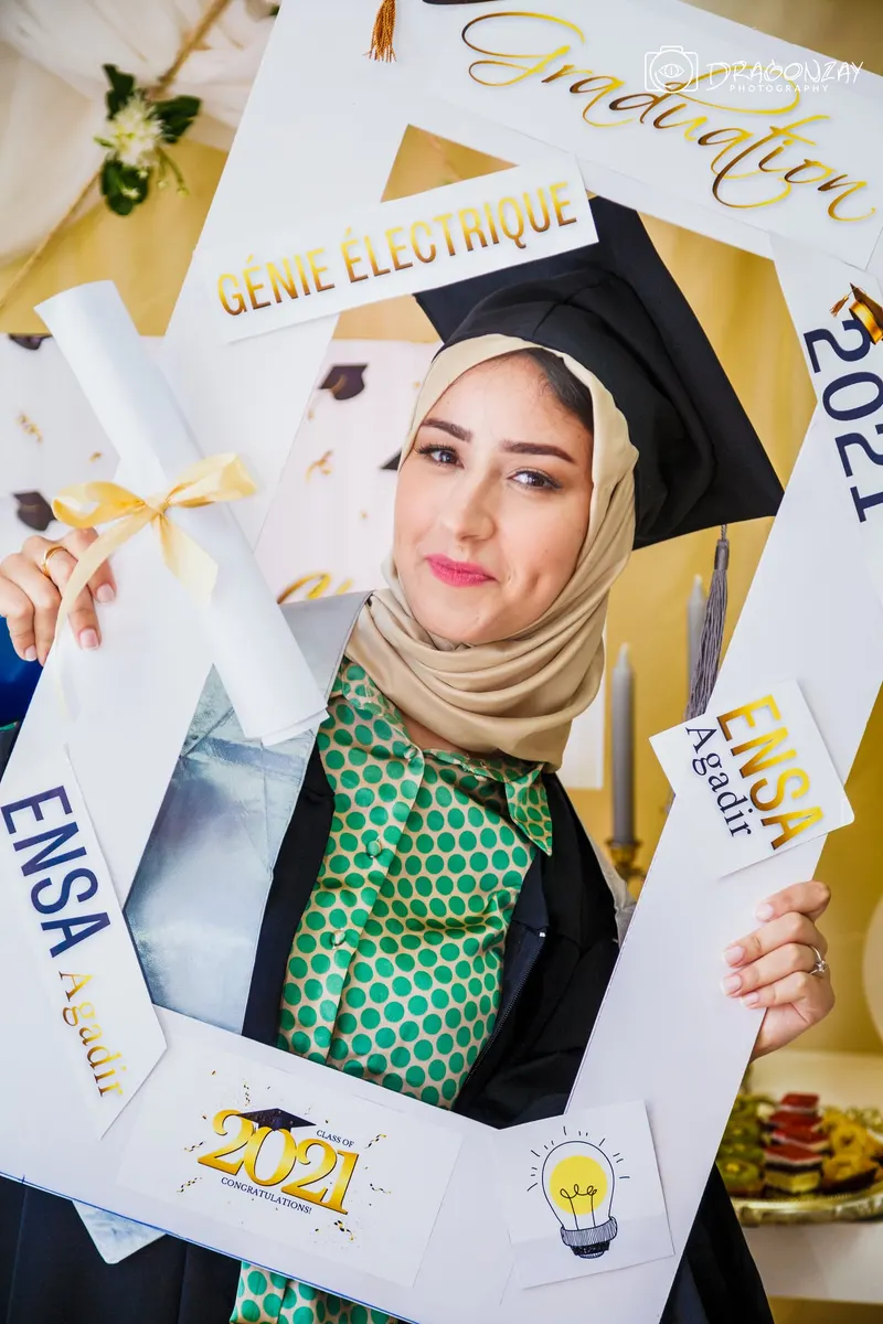 ENSA Agadir graduate posing with her photo frame - Dragonzay Photography