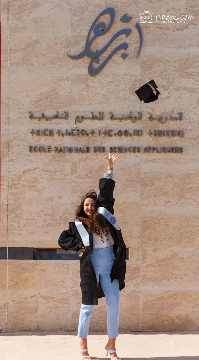 Graduate in front of the National School of Applied Sciences entrance - Dragonzay Photography