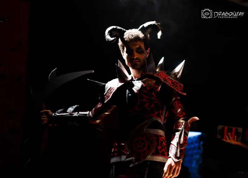 Masked horned character under blue light - Dragonzay Photography