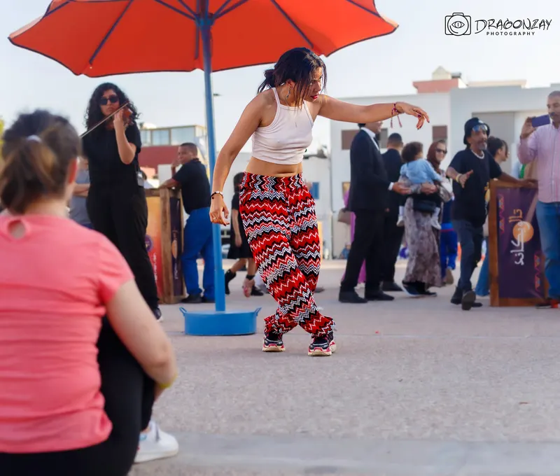 Street dancer in front of the crowd at a festival - Dragonzay Photography