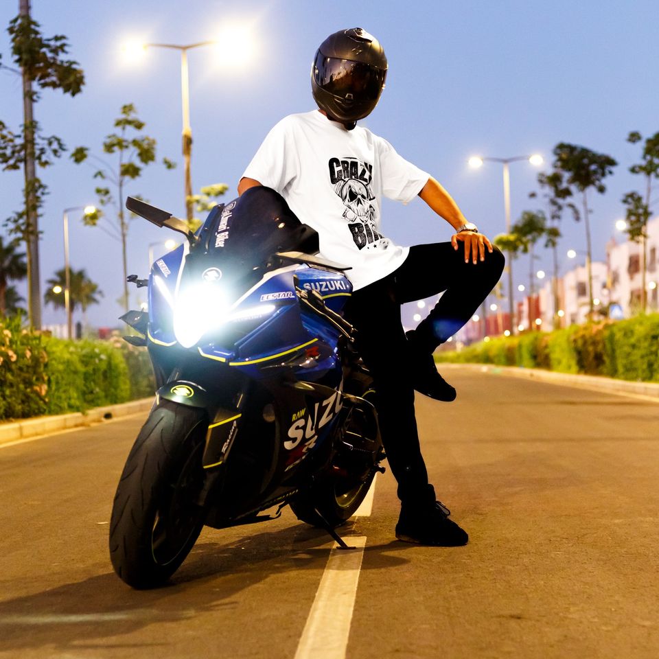 Model in a Crazy tee posing on a sports bike at night - Dragonzay Photography