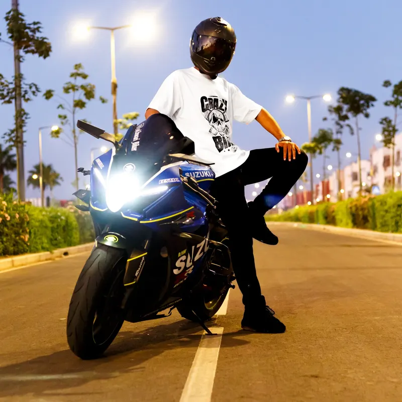 Model in a Crazy tee posing on a sports bike at night - Dragonzay Photography