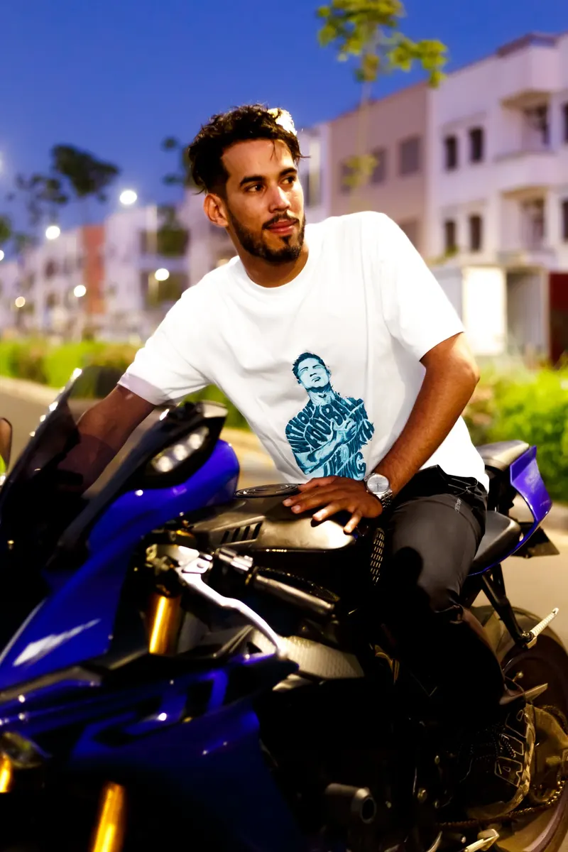 Model sitting on a motorbike in a white printed tee - Dragonzay Photography