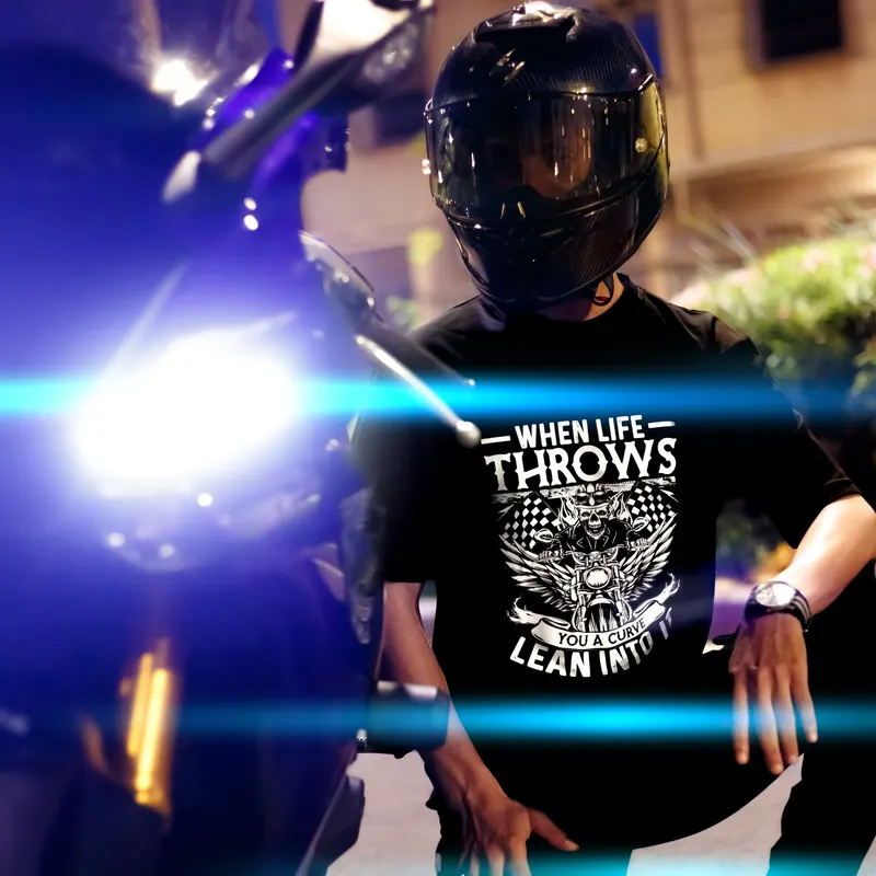 Helmeted biker in a black tee under headlights - Dragonzay Photography