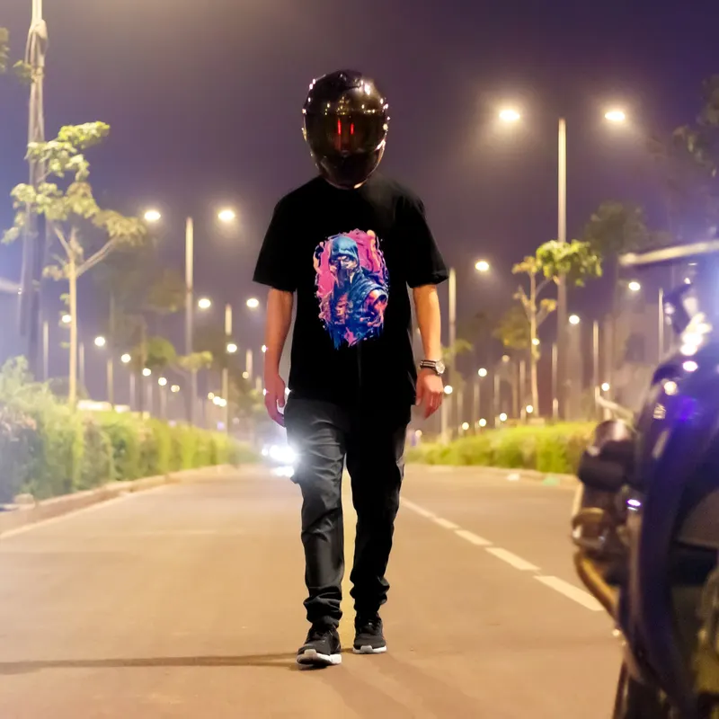 Model walking down a lit road at night in a printed tee - Dragonzay Photography