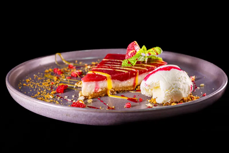 Red berry cheesecake with a scoop of ice cream - Dragonzay Photography