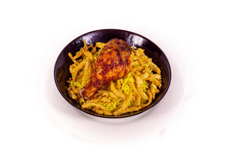 Roast chicken on a bed of vermicelli in a black dish - Dragonzay Photography