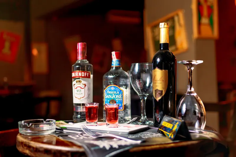 Vodka and wine bottles with two cocktail glasses - Dragonzay Photography