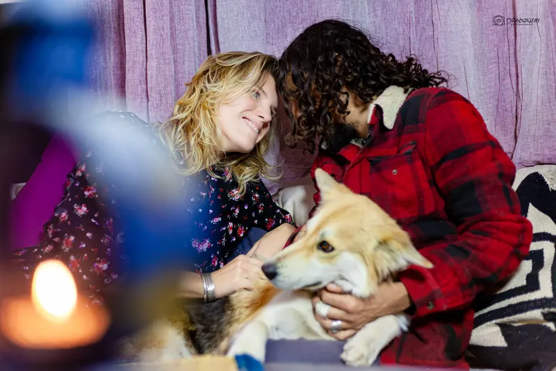 Couple with their dog at an evening gathering - Dragonzay Photography