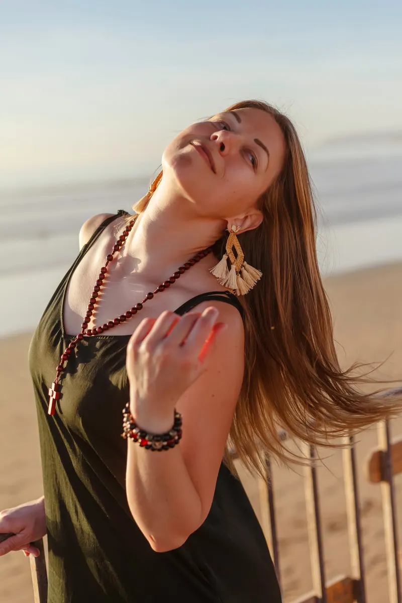Portrait of a woman in a green dress, head tilted back - Dragonzay Photography