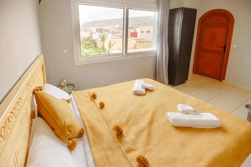 Hotel room with a yellow bedspread and a view over Agadir - Dragonzay Photography