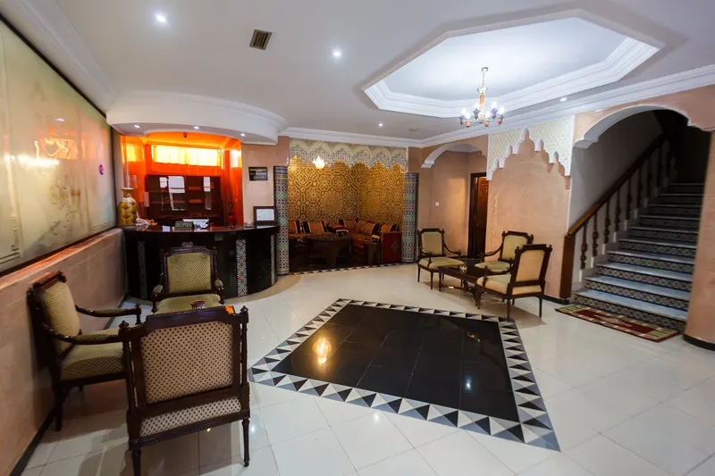 Hotel reception with armchairs and a wooden counter - Dragonzay Photography