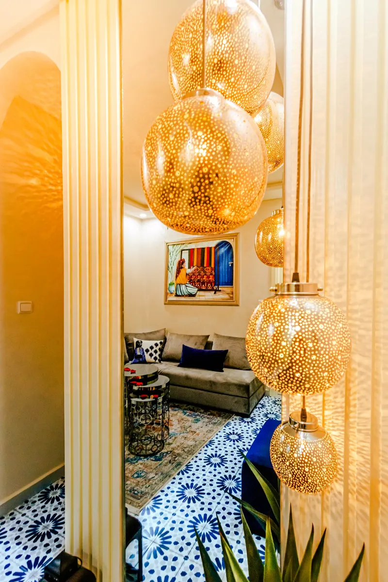 Golden lanterns hanging in a lounge - Dragonzay Photography