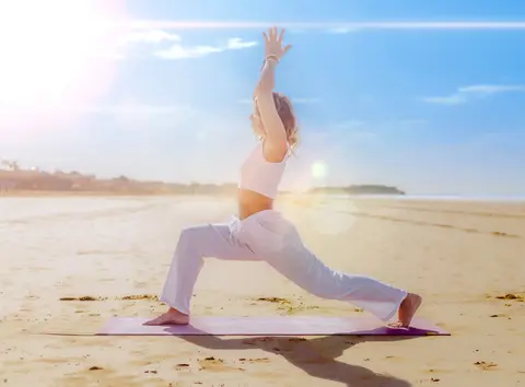 Warrior pose on Agadir beach at sunrise - Dragonzay Photography